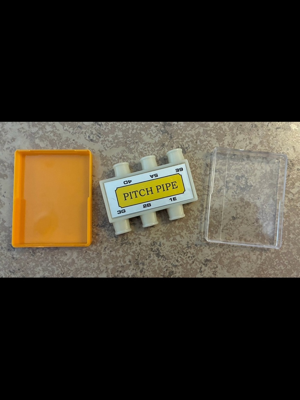 6-tone guitar pitch pipe used for tuning acoustic guitars.